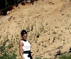 Charming hoochie in glasses pissing into the sand