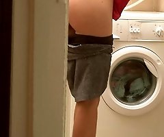 A blonde strips to do her laundry